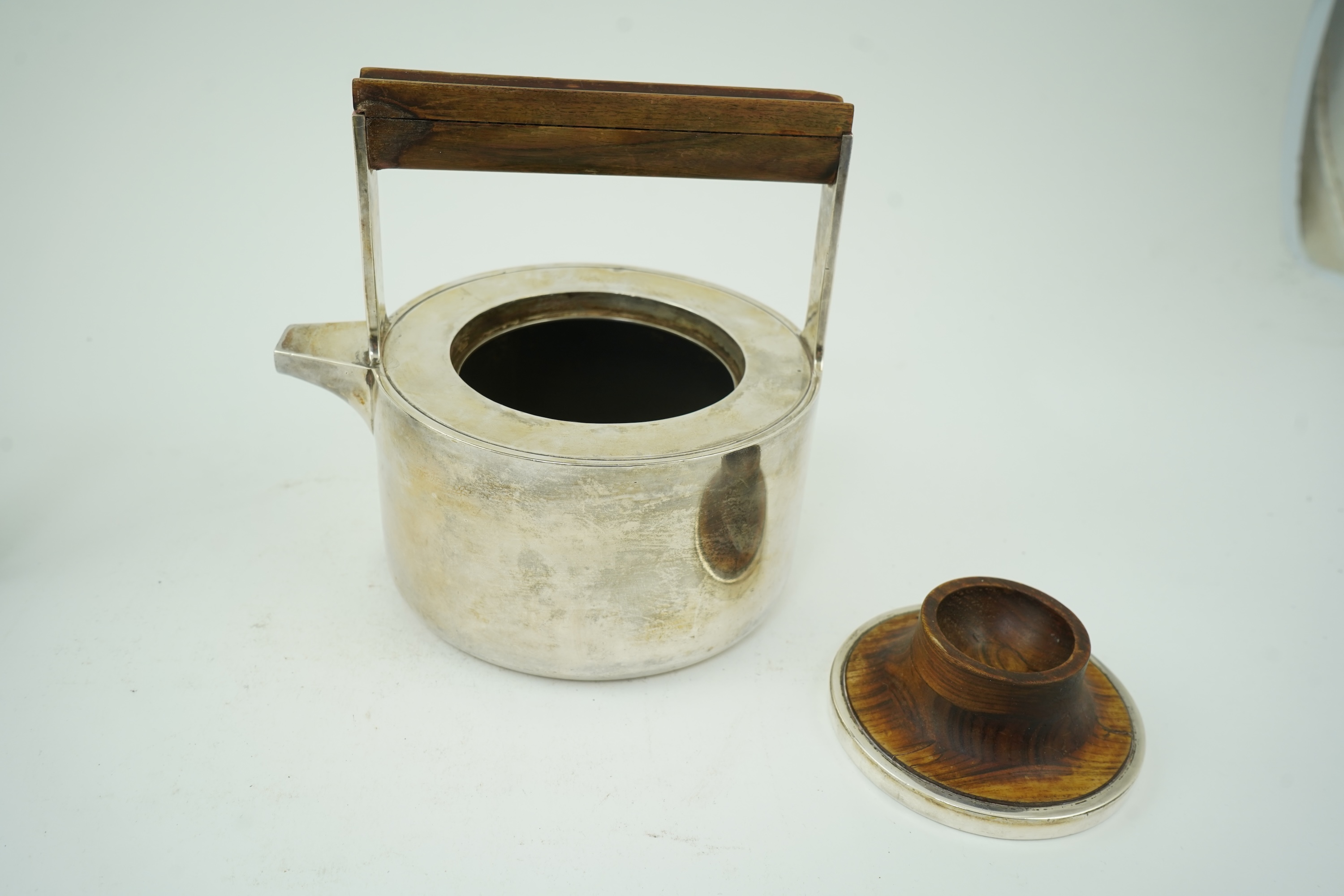 Roy Ridsdale (1942-2020): A silver tea kettle and matching cream jug